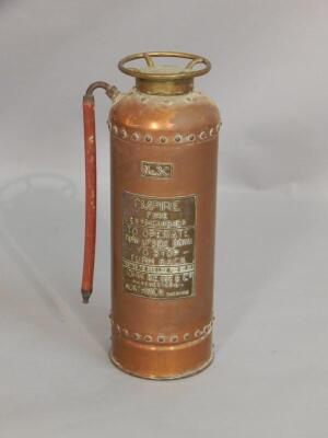 An Empire copper and gilt metal fire extinguisher