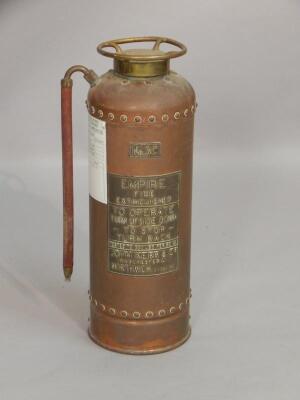 An Empire copper and gilt metal fire extinguisher