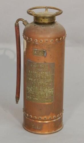 An Empire copper and gilt metal fire extinguisher