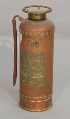 An Empire copper and gilt metal fire extinguisher