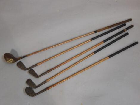 Five hickory shafted golf clubs