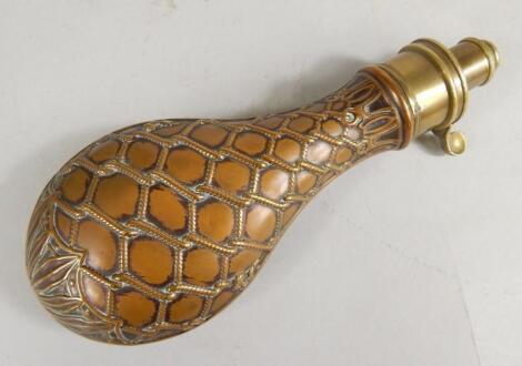 A copper and brass powder flask