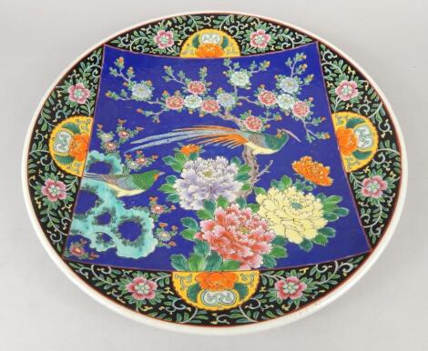 A 20thC Chinese pottery charger