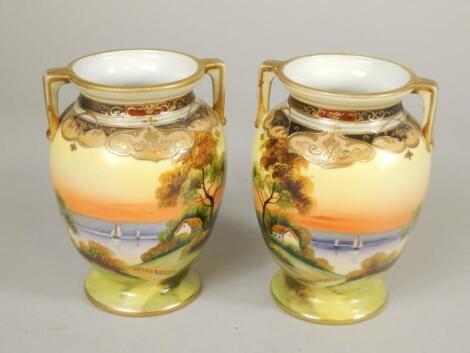 A pair of Japanese Noritake porcelain two handled vases