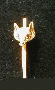 A bar brooch with foxes mask with red stone eyes