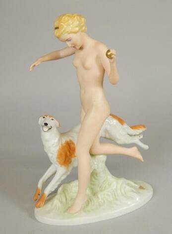 A modern Royal Dux figure of a nude female beside a dog