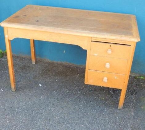 A mid 20thC light oak Retro style desk