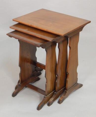 A nest of three walnut occasional tables