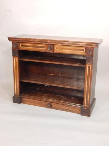 An early Victorian rosewood open bookcase