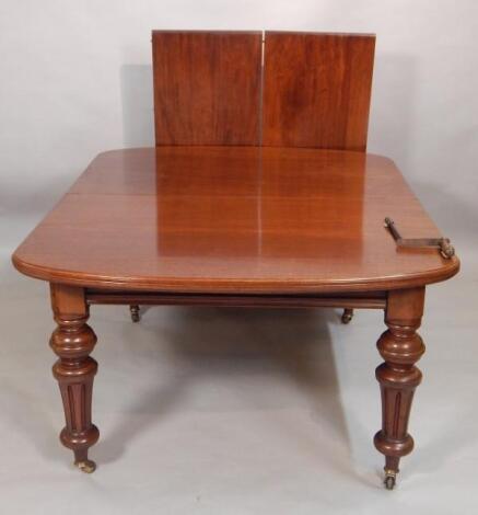 A Victorian mahogany extending dining table