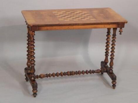 A Victorian walnut and marquetry games table