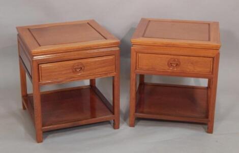 A pair of Chinese hardwood side tables