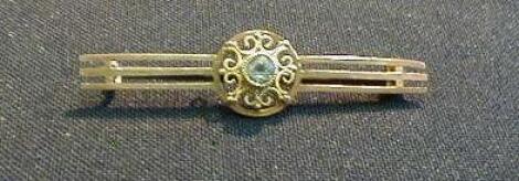 A triple bar brooch, the filigree centre section set with an aquamarine