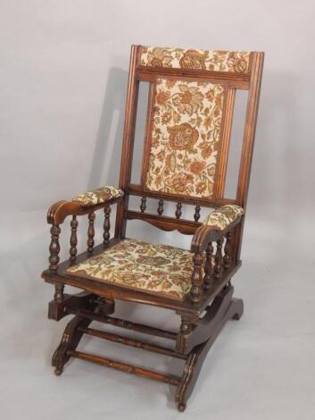 A late 19th/early 20thC American style walnut rocking chair