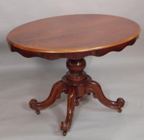 A Victorian walnut oval breakfast table