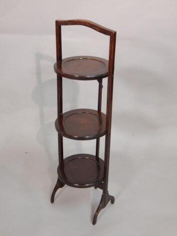 A 1920's oak three tier cake stand