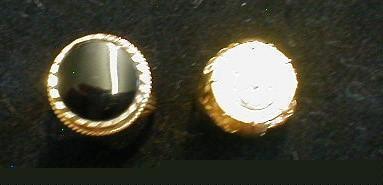 Two dress rings, one set with a circular black onyx, the other with a