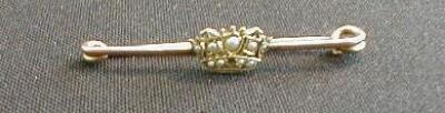 A Victorian bar brooch set with a seed pearl encrusted crown