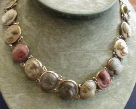 A Victorian necklace consisting of 16 linked lava cameo's