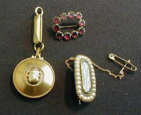 A Victorian selection including a garnet set brooch