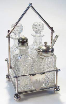 An early 20thC silver plated and cut glass four piece cruet set