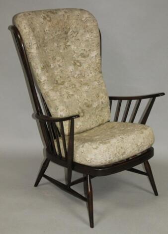A 20thC Ercol dark wood stick back chair