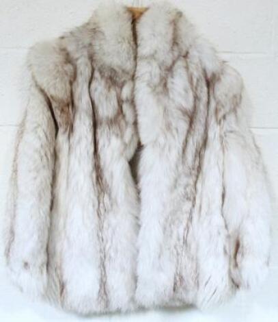 A ladies silver fox fur coat