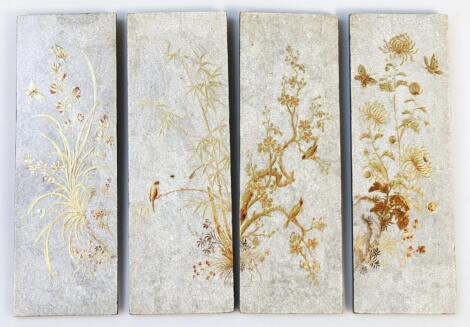 A set of four Japanese lacquered panels