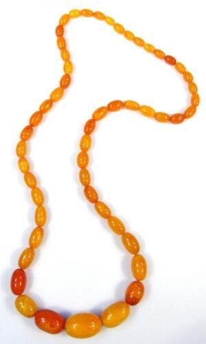 Various mustard coloured amber beads