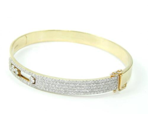 A yellow metal and diamond set bangle