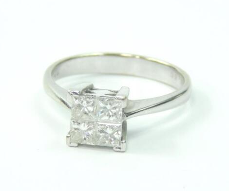 An 18ct white gold and diamond four stone ring