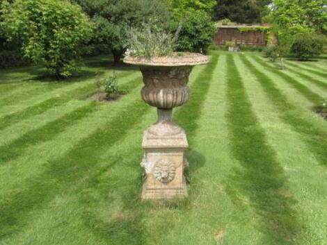 A terracotta campana garden urn