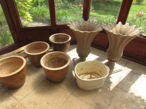 A pair of plastic lobed planters