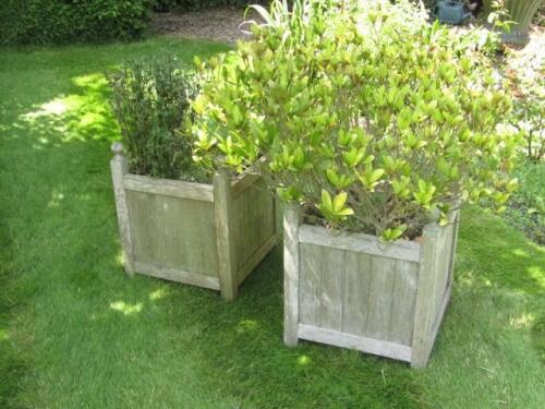 A set of four hardwood planters