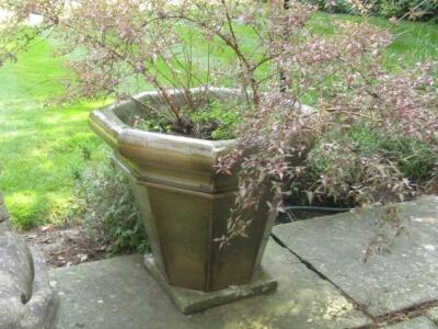 A pair of celadon glazed octagonal garden planters