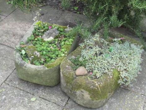 Two bullnose hand hewn stone troughs