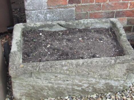 An 18thC hand hewn stone trough