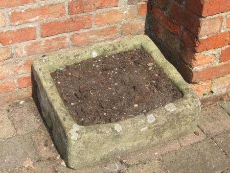 A hand hewn stone trough