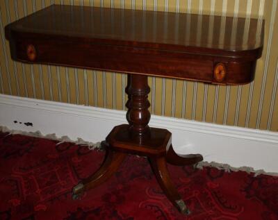 A George IV mahogany and satinwood card table