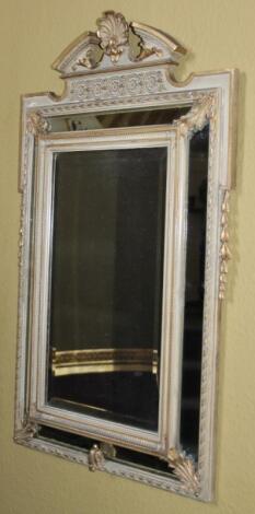 A Continental gilt gesso and painted wall mirror