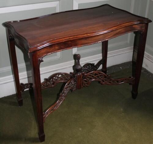A modern mahogany table in Chippendale style