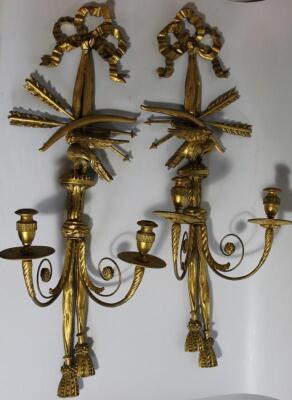 A pair of early 19thC giltwood and gesso wall lights