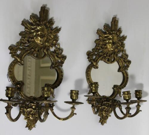 A pair of Continental brass girandoles