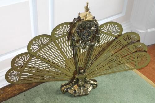 A brass fan shaped folding spark guard in 19thC style