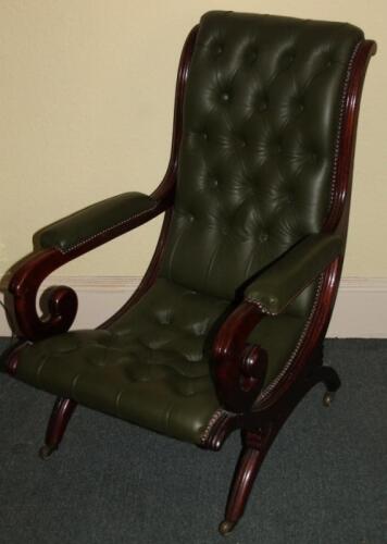 A Victorian mahogany open arm chair