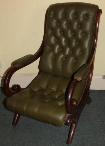 A Victorian mahogany open arm chair