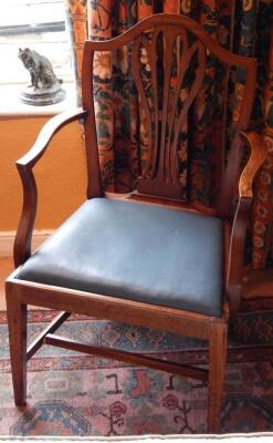 A George III mahogany open arm chair