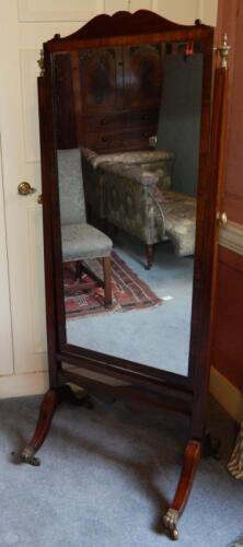 A mahogany and ebony strung cheval mirror in Regency style