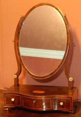 An early 19thC mahogany and boxwood strung dressing table mirror