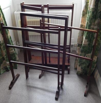 Four early 20thC mahogany clothes rails